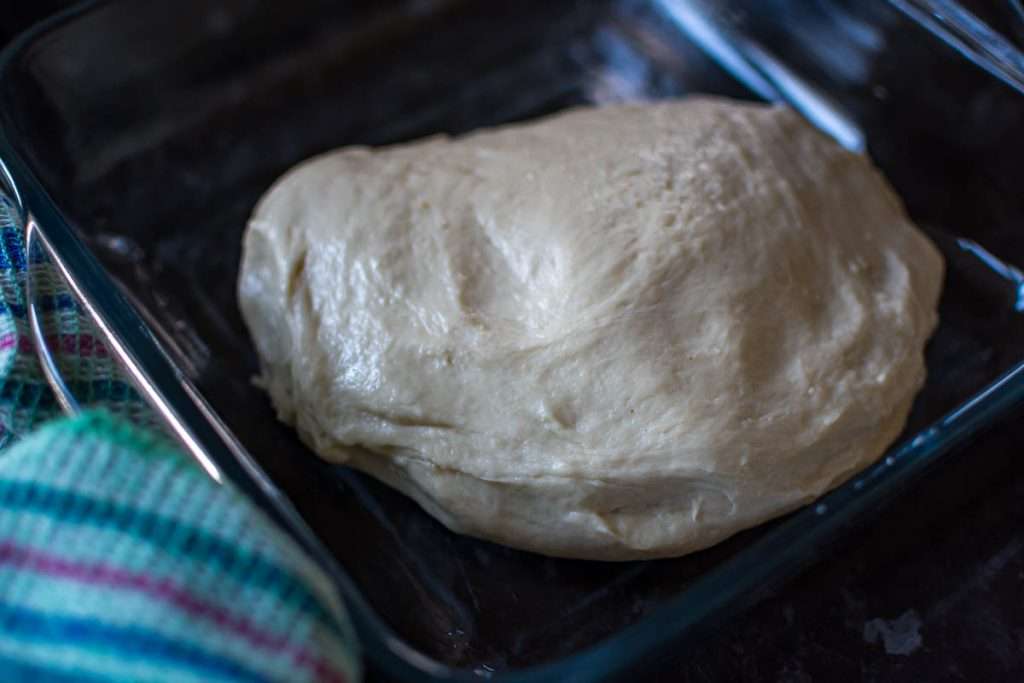 Sourdough in a shallow glass dish ready for bulk fermentation.