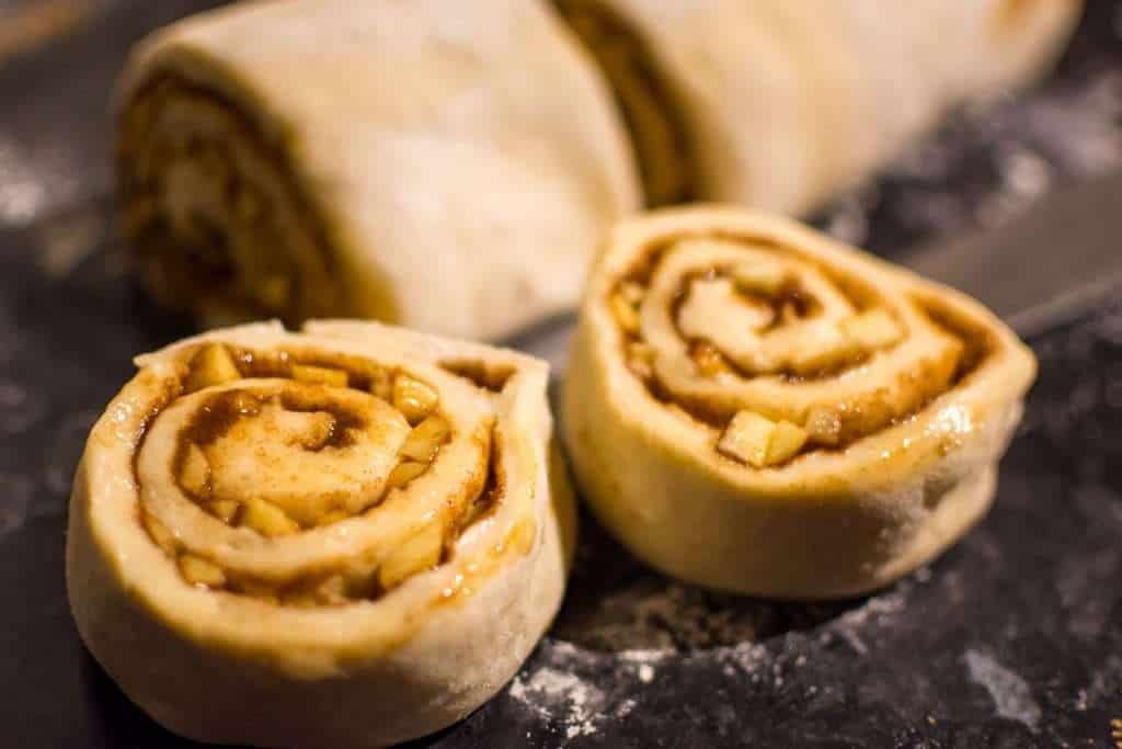 Sourdough apple cinnamon rolls cut into pieces.