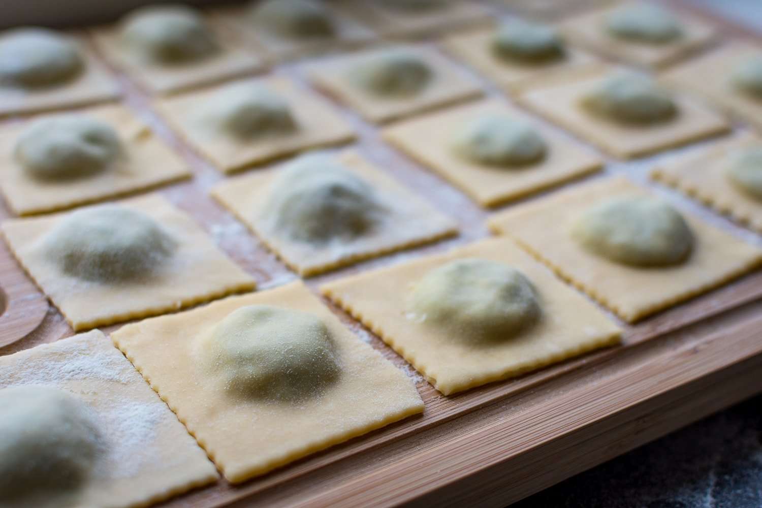 Ravioli on a wooden board.