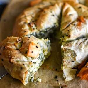 Small Spanakopita spiral with a slice cut.