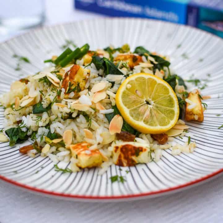 Halloumi Rice Bowl garnished with a lemon slice.