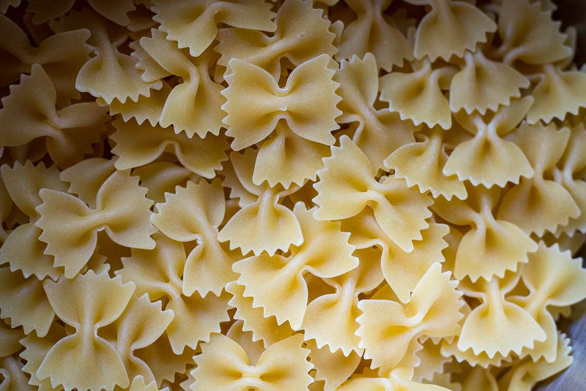 Bow-tie pasta in a pan.