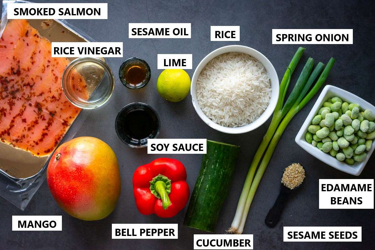 Ingredients for Smoked Salmon Poke Bowls on a dark surface.