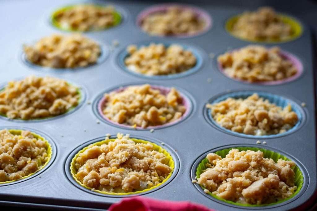 Lemon muffin batter topped with streussel topping.
