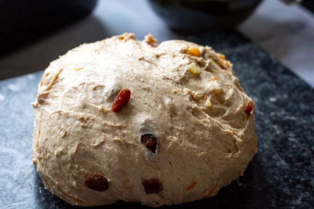 Fruit incorporated into a hot cross bun dough.