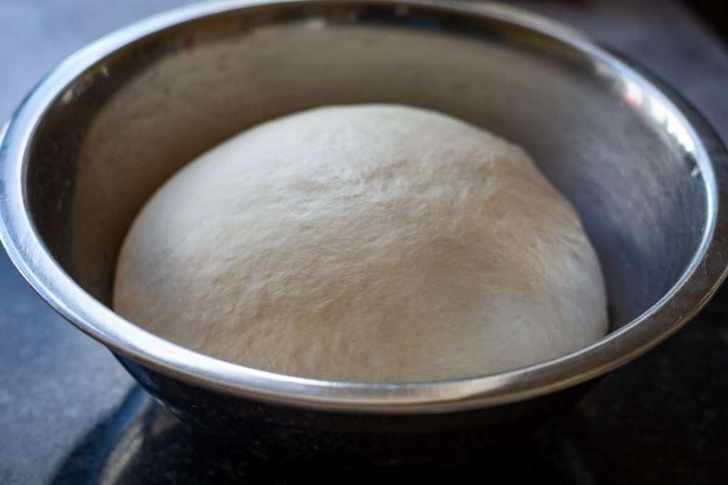 The naan dough after proofing doubled in size.