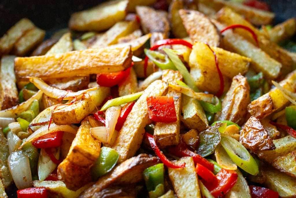 Chips tossed with veggies, aromatics and Chinese five spice seasoning.