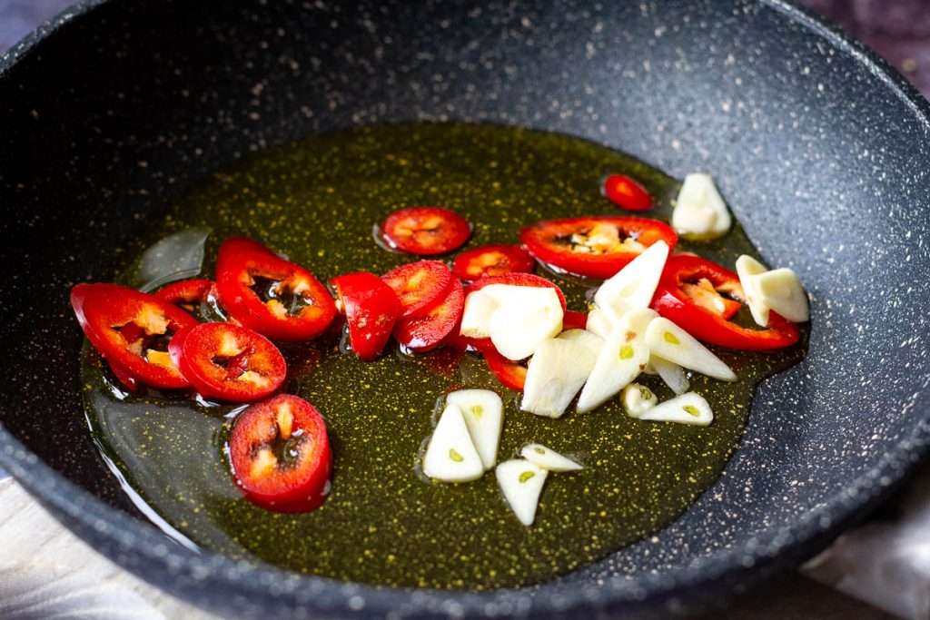 Garlic and chilli in olive oil in a small frying pan.