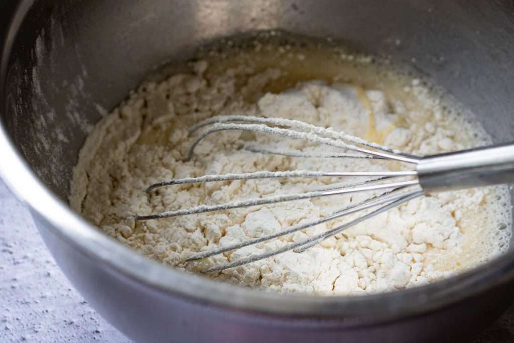 Flour added to the wet ingredients.