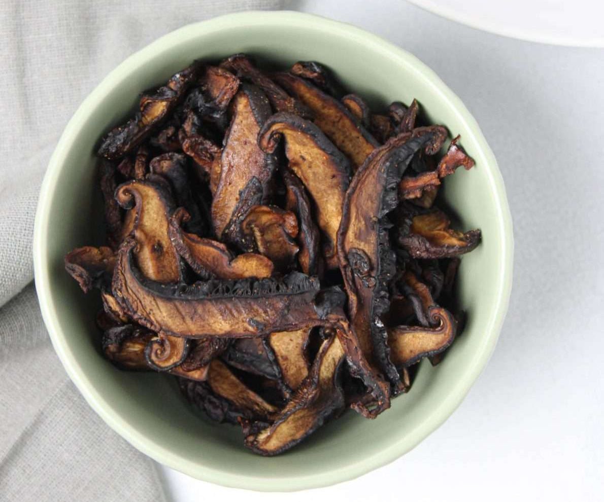 Shiitake mushroom jerky in a white bowl.
