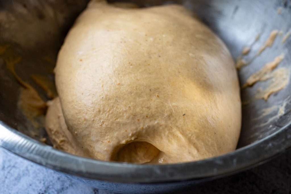 Coil folded sourdough in a large mixing bowl.
