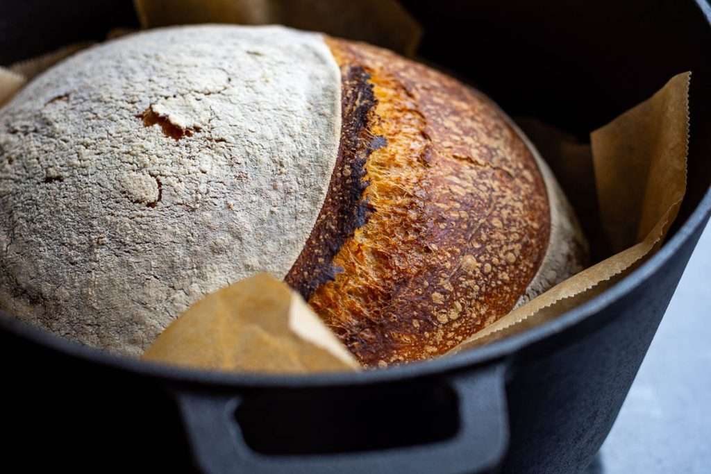 Deep brown sourdough after baking it with the lid off.