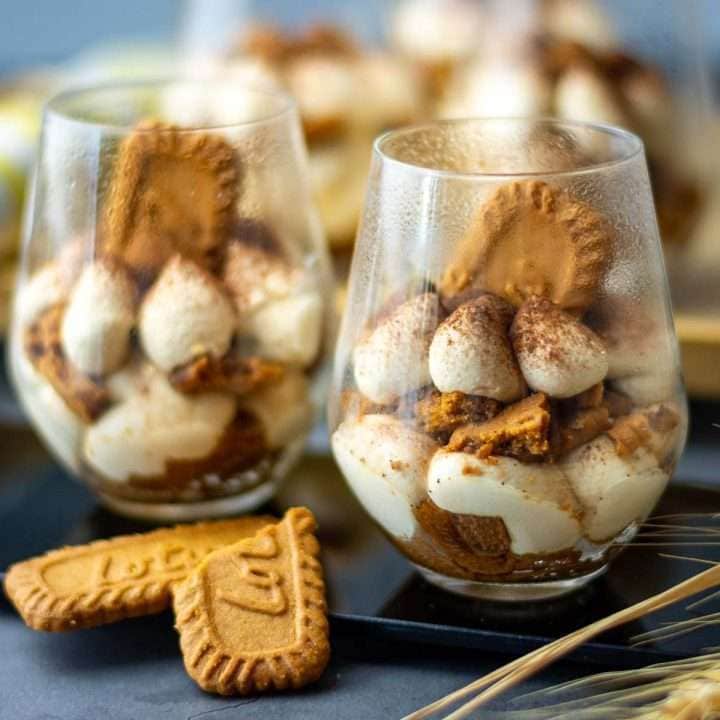 Individual glasses with biscoff tiramisu decorated with biscoff cookies.