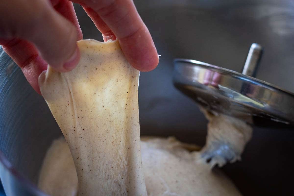 Sourdough being stretched out for windowpane test.