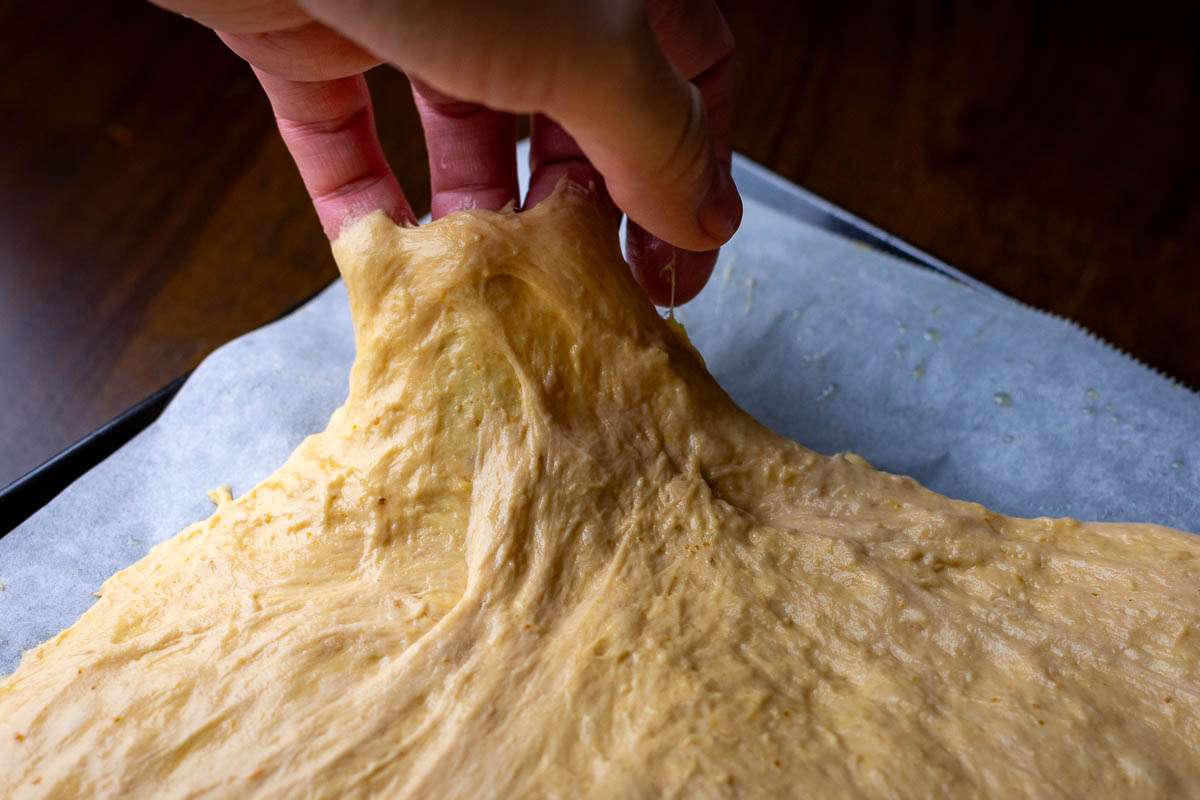 Stretching high-hydration sourdough.