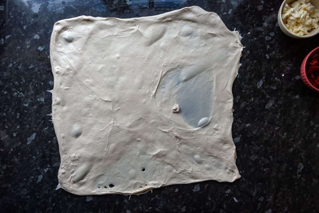 Sourdough stretched out into thin ractangle for laminating.