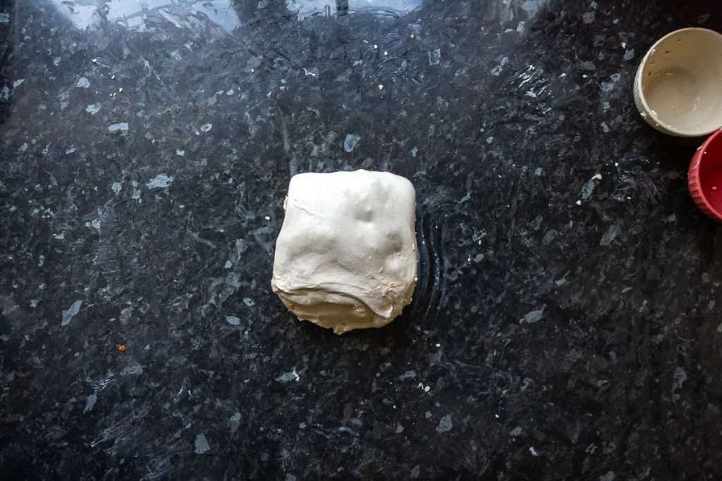 Feta and sundried tomatoes being laminated into the sourdough.