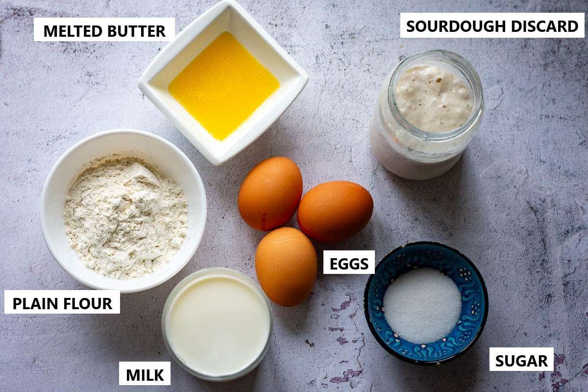 Ingredients for Sourdough Crepes on a concrete surface.