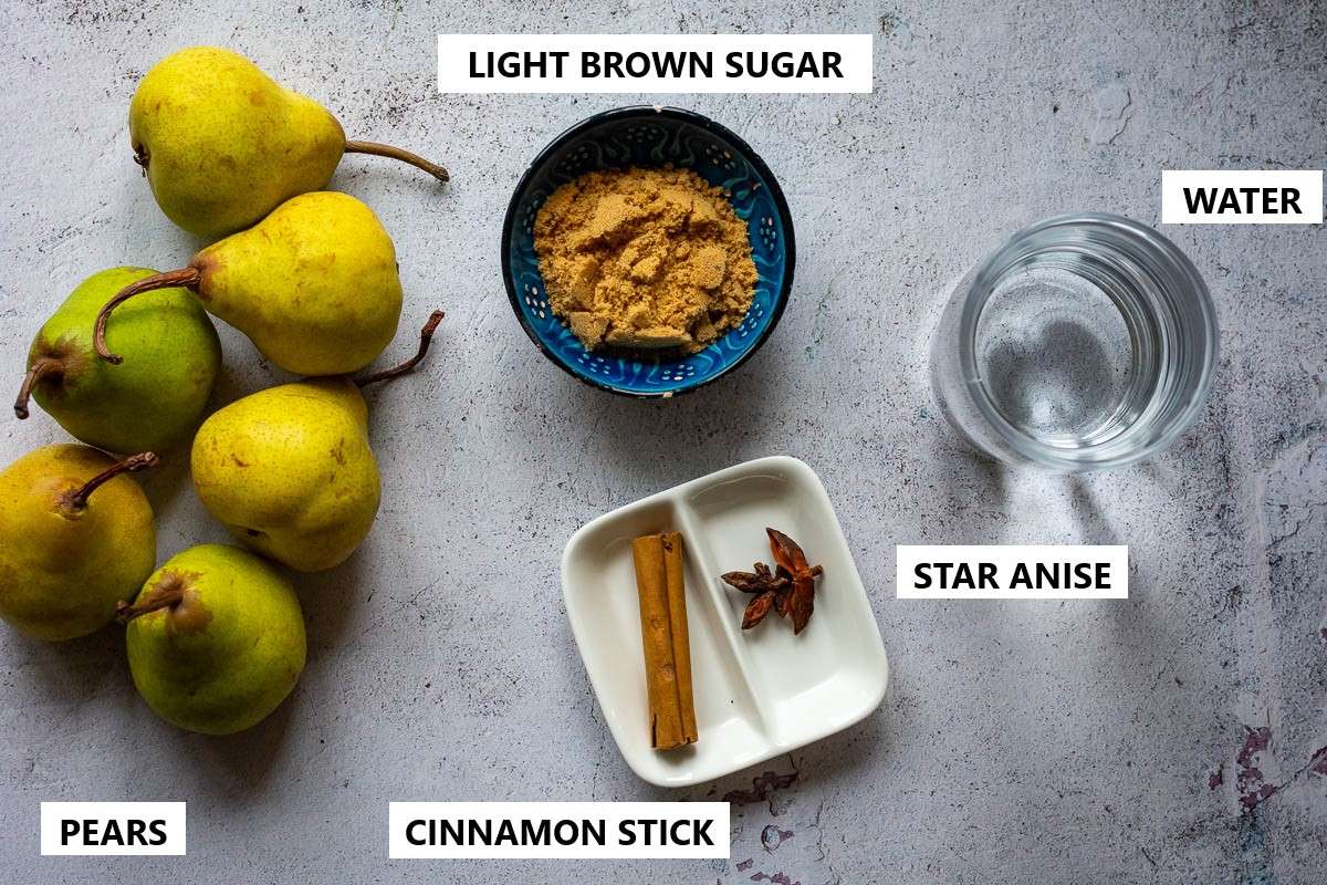Ingredients for easy stewed pears on a light grey surface.