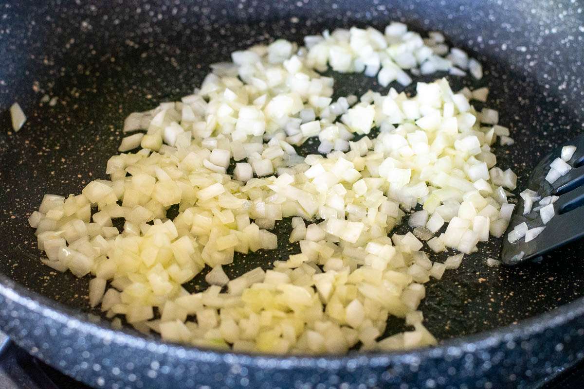 Sauteed onions in a pan.
