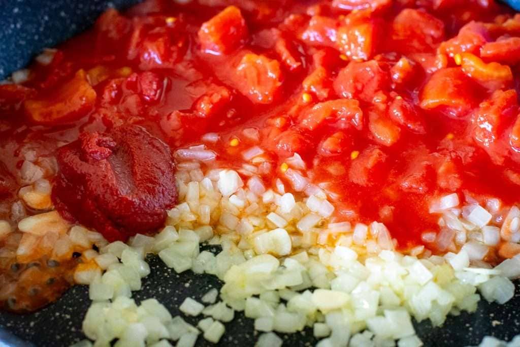 Tomato added to onion and garlic.