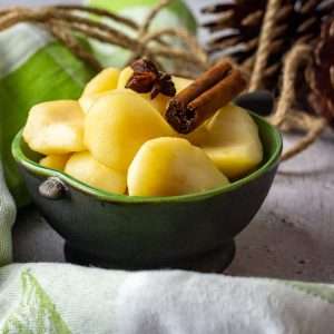 Lightly spiced stewed pears with cinnamon stick and star anise on top.