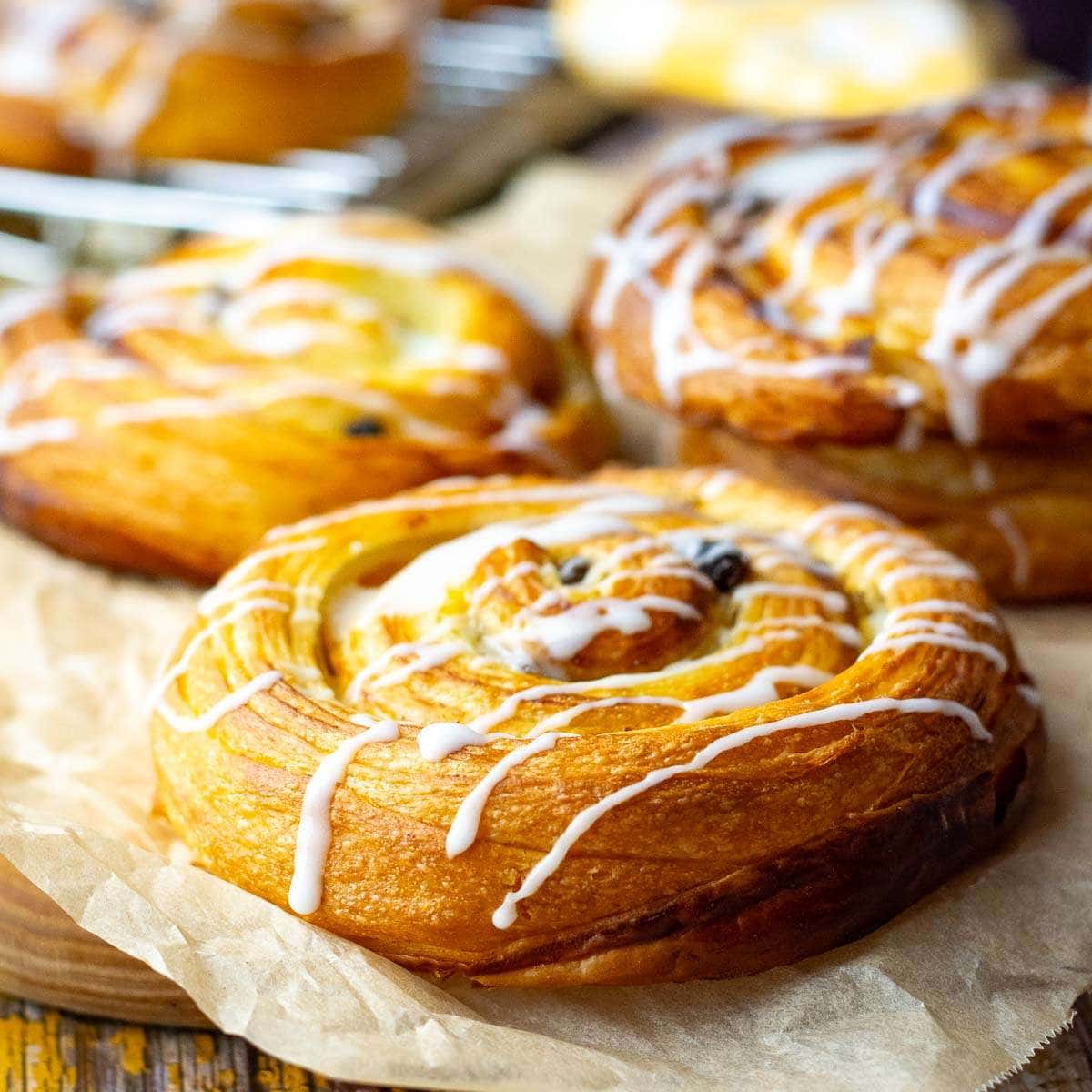 Sourdough Pain Au Raisins drizzled with icing.