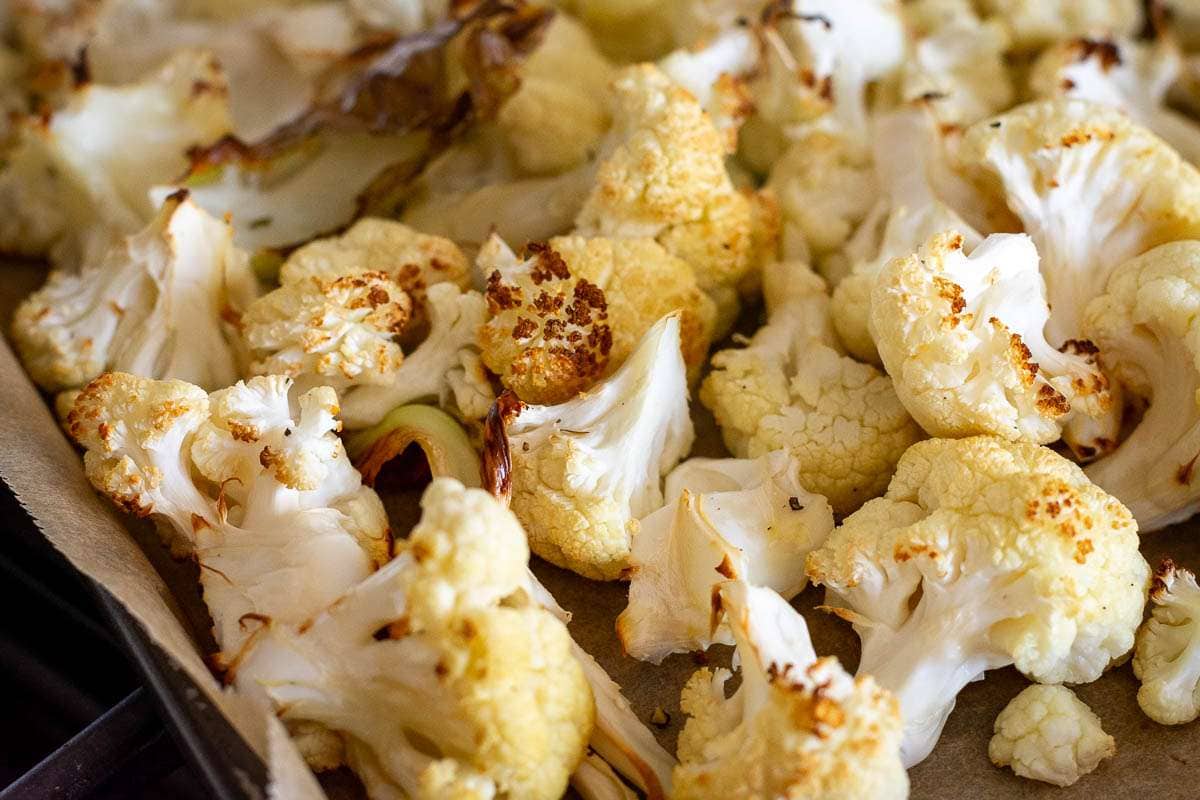 Roasted cauliflower on a baking sheet.