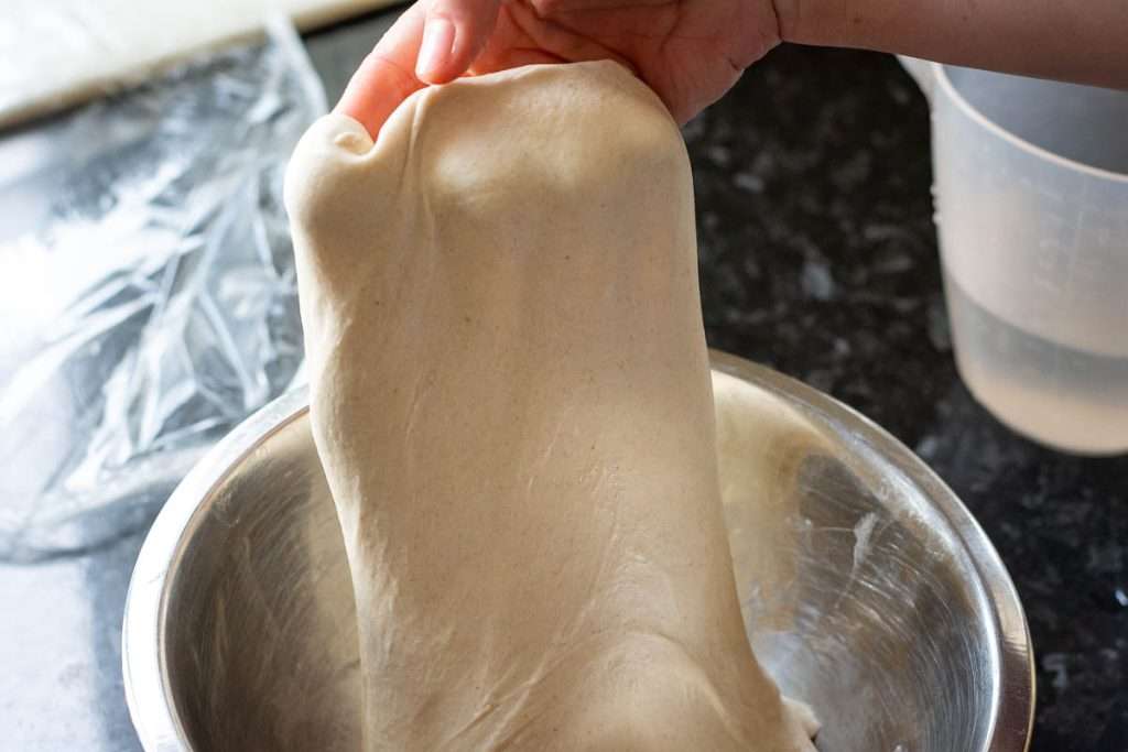 One side of sourdough strethced out upwards.
