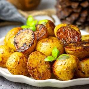 Roasted Balsamic Potatoes on a white decorative plate.