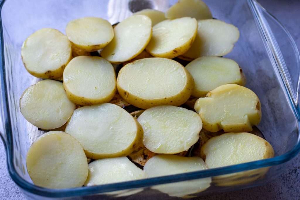 Potato slices on top of aubergine slices.