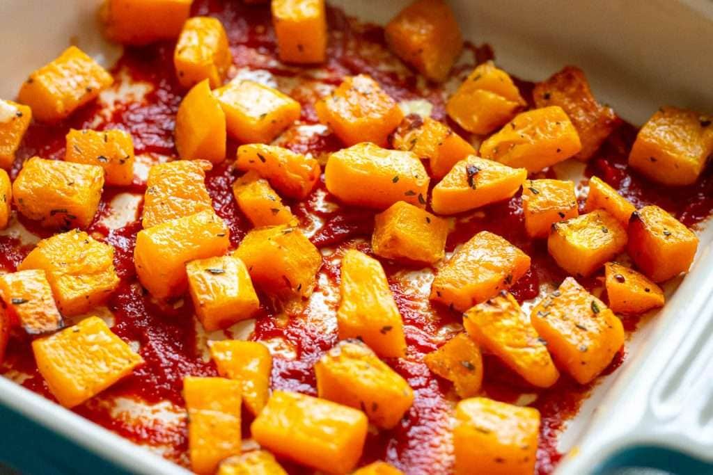 roasted butternut squash cubed on top of the tomato layer.