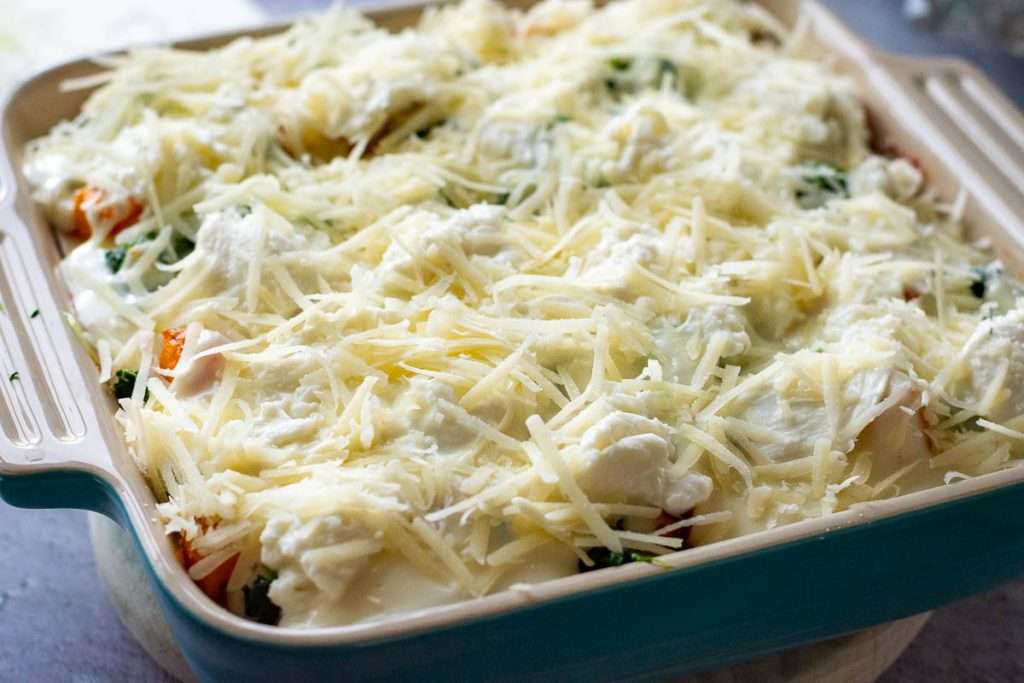 Parmesan and mozzarella on top of the butternut squash and spinach lasagna.