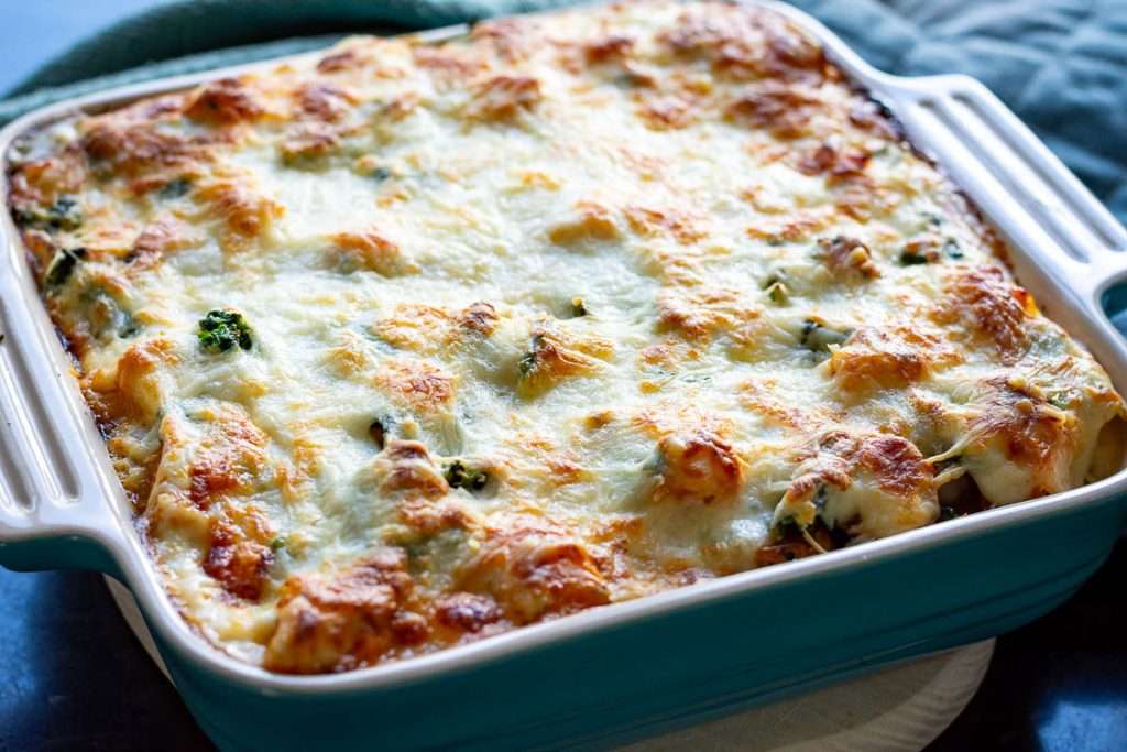 Baked vegetable lasagna with golden brown top.
