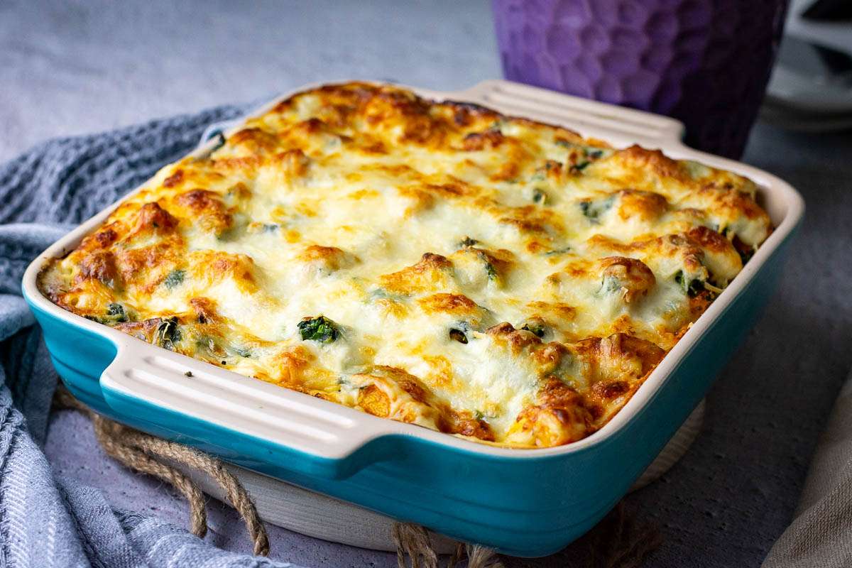 A whole baked butternut squash lasgana in a casserole dish ready to be served.
