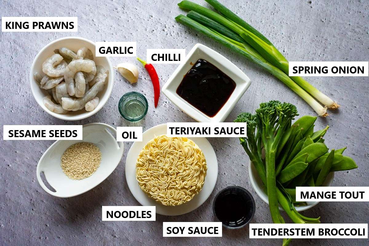 Ingredients for Teriyaki Prawn Stir Fry Noodles on a light grey surface.
