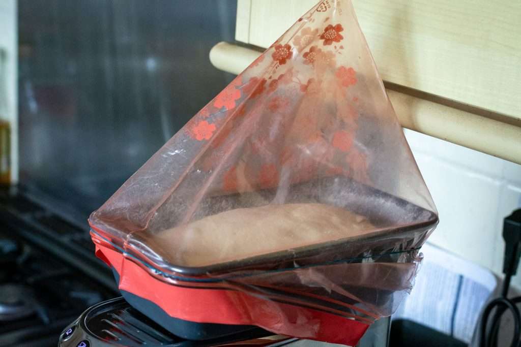 A ziplock bag placed on top of the sourdough for second proof.