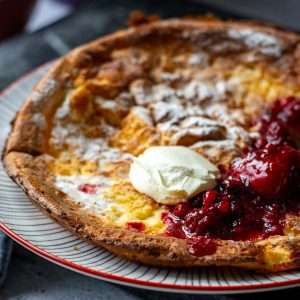 Sourdough Dutch Baby With Yogurt and Berry Compote.
