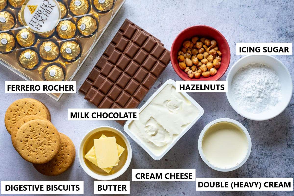 Ingredients for no-bale ferrero rocher cheesecake on a light kitchen surface.