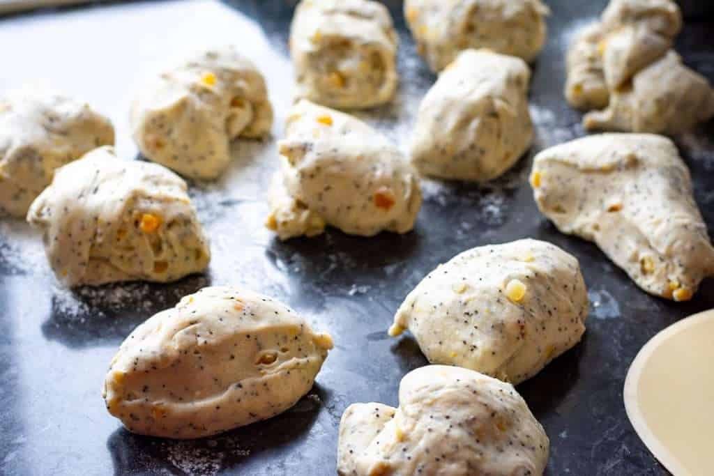 Bun dough divided into 12 even pieces.