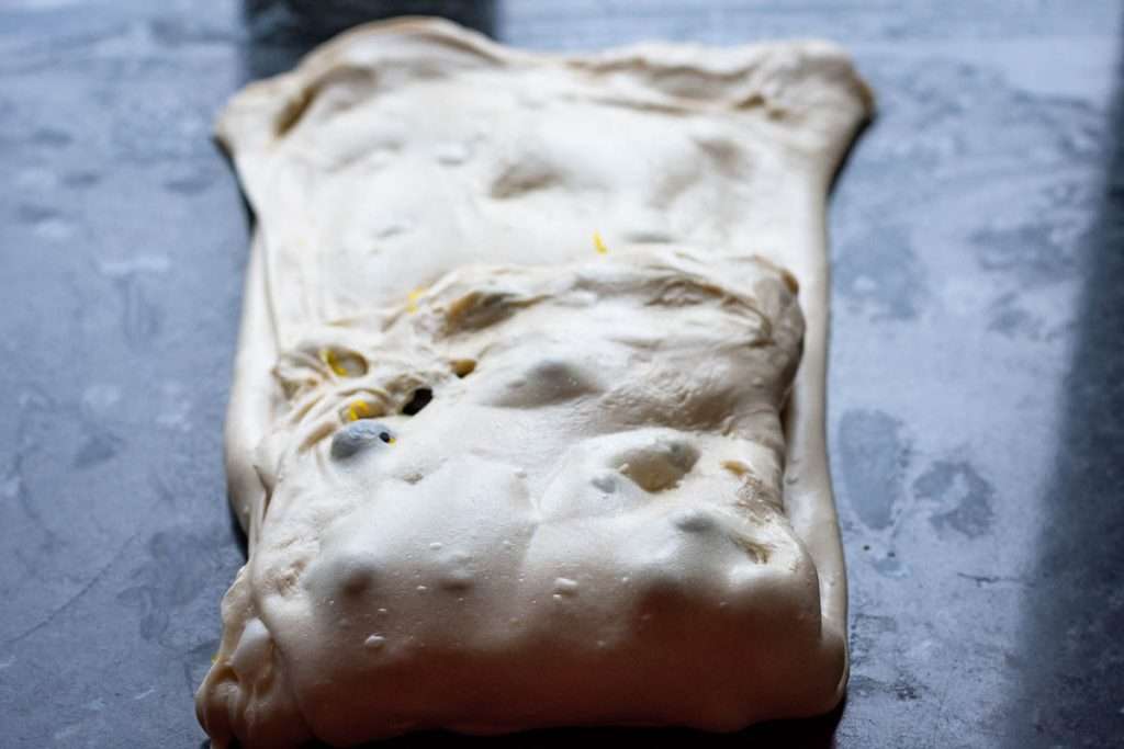 Bottom part of the dough folded into the middle.