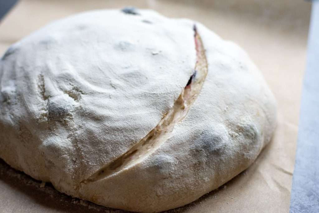 One deep slash scored into the sourdough boule.