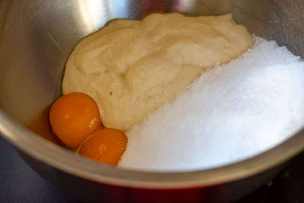 Sourdough discard, eggs, sugar and oil in a large mixing bowl.