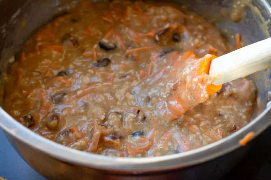 Wet and dry ingredients mixed in a large mixing bowl.