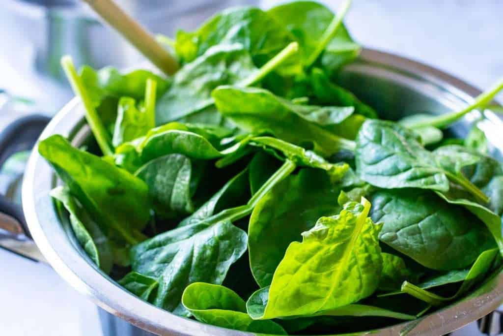 Spinach added to the onion mixture.