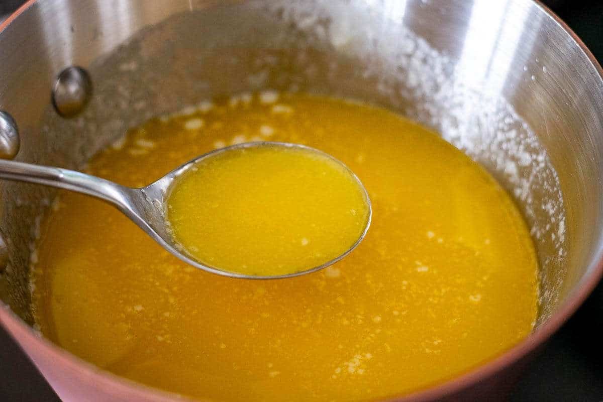 Melted butter in a copper pan.