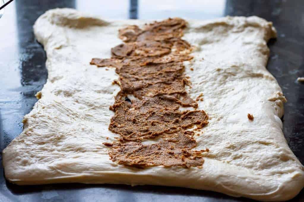 Laminating sourdough with the cinnamon butter filling.