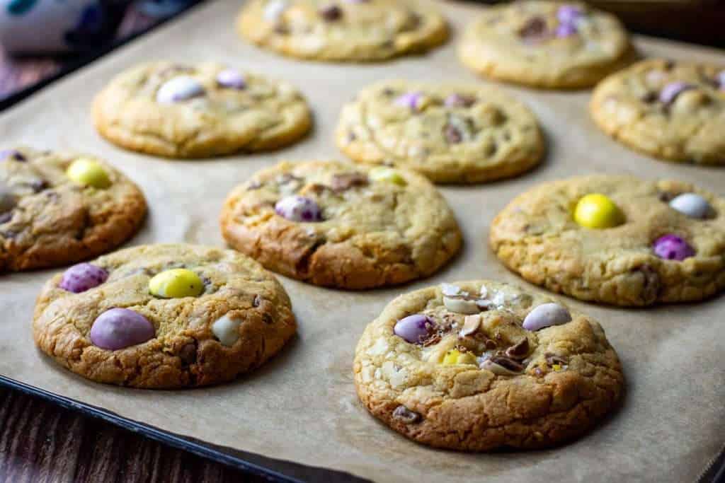 Easter Cookies with Mini eggs cooling on a baking sheet.
