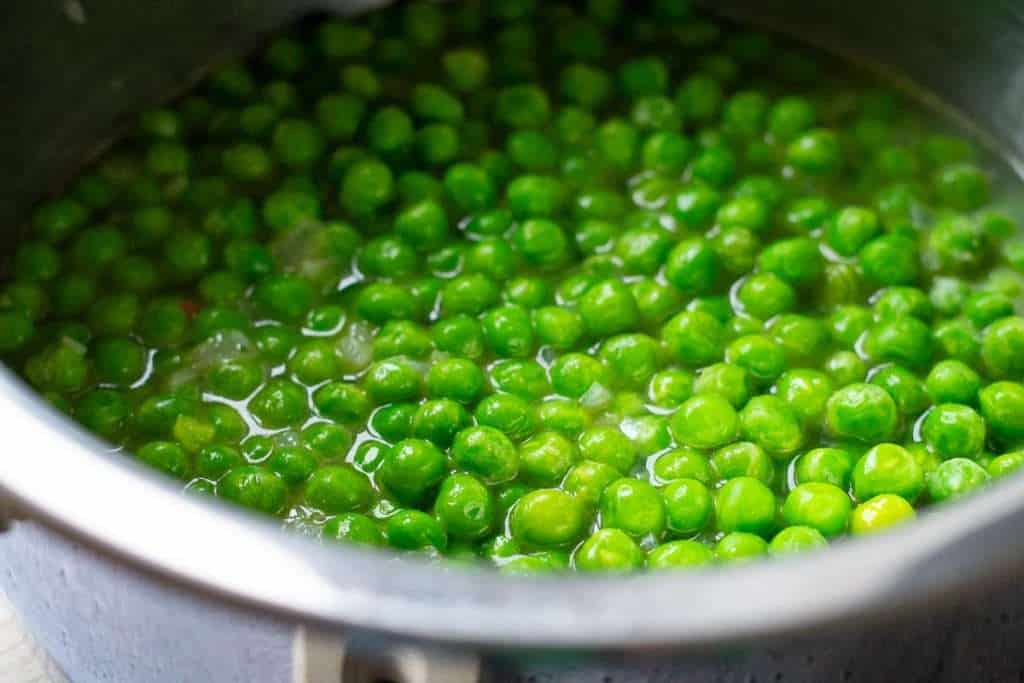 Peas and onion in stock.