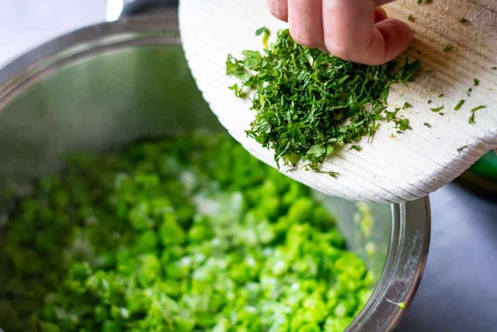 Fresh mint being added to the mushy peas.